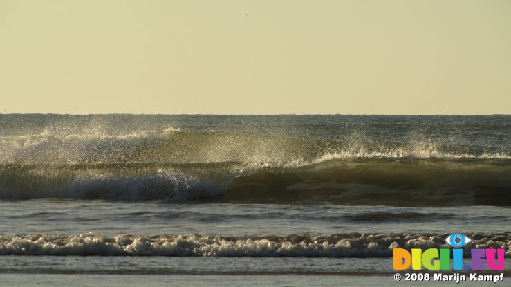 SX00685 Spray of small waving braking on Tramore beach